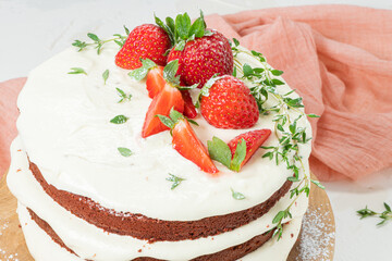Red velvet cake on wood board. Strawbwrry cake. Devils cake. Wedding dessert. Birthday party. Delicious dessert. Traditional american dessert.