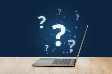 Question mark concept or FAQ. Holographic sign over laptop