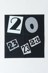 20 and 23 on blank paper