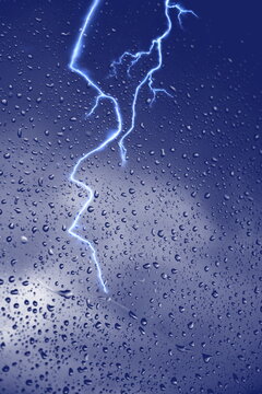 Rain Drops Window Glass And Stormy Lightning Nature Weather Forecast Defocus Background 