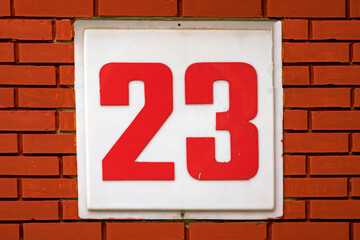 Number 23 on brick wall