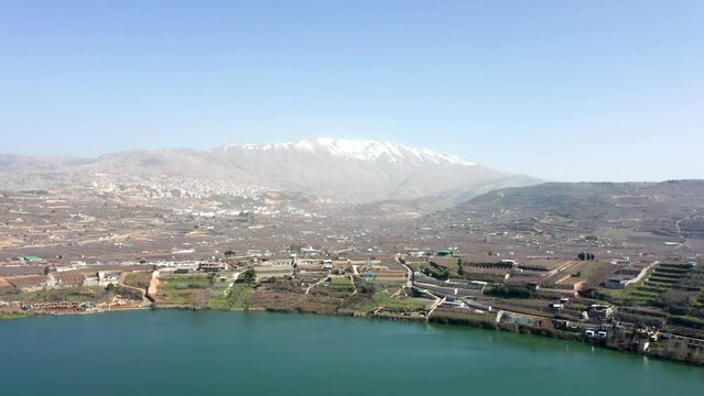 Ram Lake and snowy mount Hermon in Northern Israel, Drone footage.
