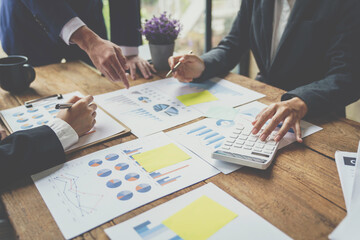 Business Corporate People Working Concept, Business people using pen,tablet,notebook are planning a marketing plan to improve the quality of their sales in the future.