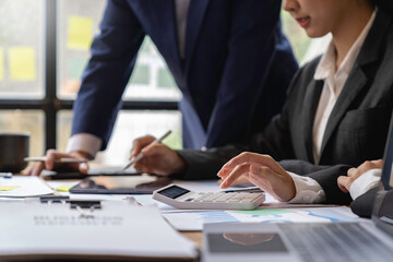 team of financiers are analyzing the company's earnings at meetings, intercompany business meetings.