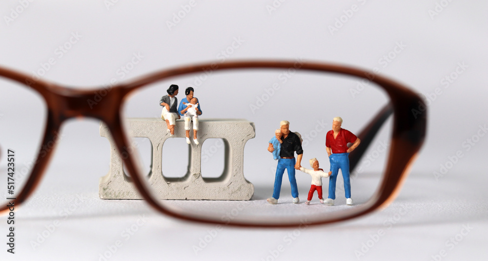 Canvas Prints Business concept with a glasses and a miniature gay couple family. Concept about 'love is love'. 
