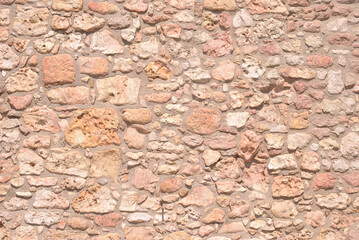 Textura de pedras brancas desgastadas pela água do mar, muro