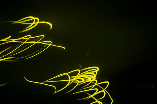 luminous trail of a firefly in long exposure - Powered by Adobe