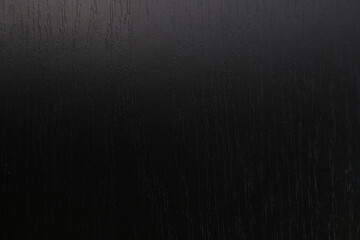 Dark gray background from natural slate. Texture of stone closeup. Graphite background macro