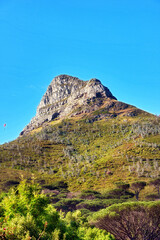 Fototapeta na wymiar Low angle of a mountain peak in South Africa. Scenic landscape of a remote hiking location on Lions Head in Cape Town on a sunny day with copy space. Stunning adventure and travel place to explore