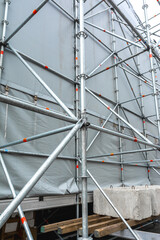Rear view of the installed metal scaffolding for the outdoor stage. Preparation of concert equipment