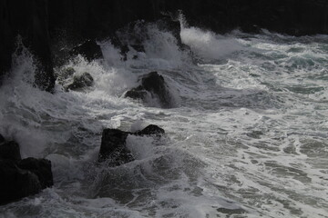Waves against rocks 