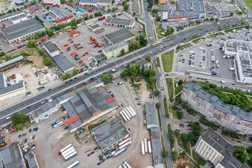 aerial view of industrial area with industrial buildings and residential district with apartment houses and shopping malls