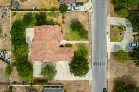 Aerial Drone View Of American Suburban Neighborhood. Establishing Shot Of America's Suburb. Residential Single Family Houses Pattern.