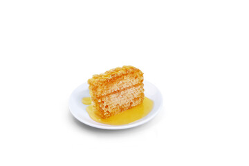 beeswax honeycomb yellow natural honey slices on white plate isolated on white background