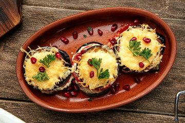 Aubergine and tomatoes appetizer with garlic sauce and cheese