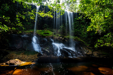 Beautiful tropical rainforest waterfall in deep forest, Phu Kradueng National Park, Thailand