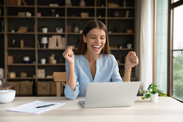 Happy female office employee read pleasant e-mail on laptop, get career advancement, promoted, celebrate salary growth, receive fantastic news with sell-out, professional success, new software concept