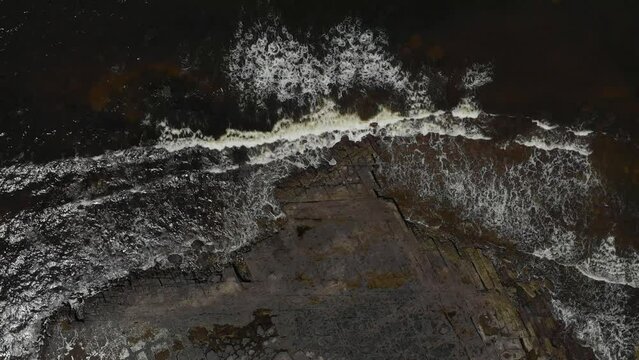 Drone video of Moona Moona Creek and Huskisson beach area after recent flooding with brown dirty water flowing into the bay
