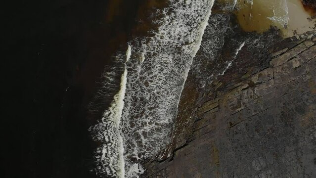 Drone video of Moona Moona Creek and Huskisson beach area after recent flooding with brown dirty water flowing into the bay