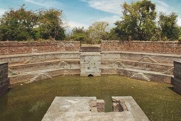 Outside the mosque, there is an octagonal tank with steps for ablutions.