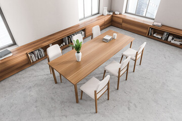 Top view of light dining room interior with chairs and table, shelf and window