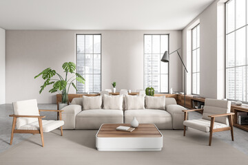 Front view on bright studio room interior with sofa, table