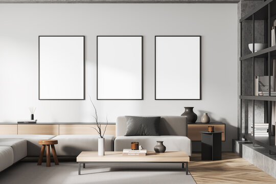 Light chill room interior with couch and decoration, shelf and mockup frames