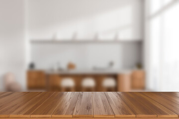 Wooden countertop on blurred background of light kitchen interior. Mockup