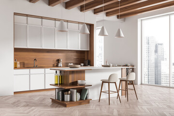 Light kitchen interior with countertop and seats, decoration and panoramic window