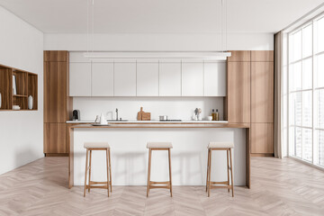 Light kitchen interior with countertop and seats, shelves and decoration, window