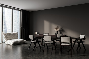 Dark meeting room interior with wooden table and couch, panoramic window