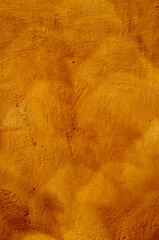 Old plastered wall in vintage orange