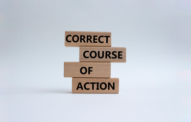 Correct course of action symbol. Concept words Correct course of action on wooden blocks. Beautiful white background. Business and Correct course of action concept. Copy space.