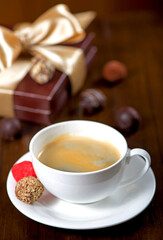 Coffee and cake. a cup of coffee and candy on vintage wooden background