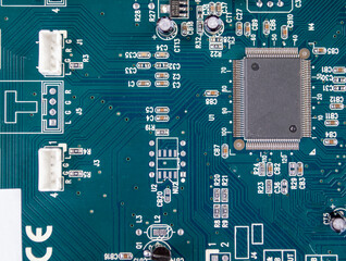 Electronic circuit board with electronic components such as chips close up.