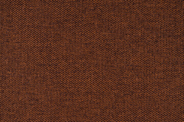 Close-up texture of natural brown coarse weave fabric or cloth. Fabric texture of natural cotton or linen textile material. Blue canvas background. Decorative fabric for upholstery, furniture, walls