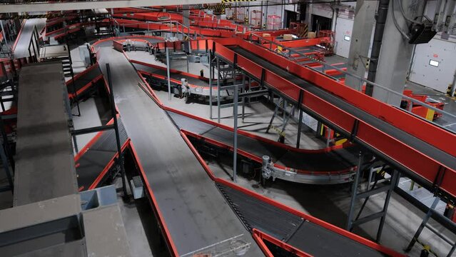 Parcels Are Moving On Belt Conveyor At Post Sorting Office.