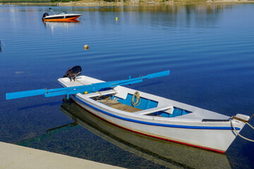 Small wooden boat on pier
