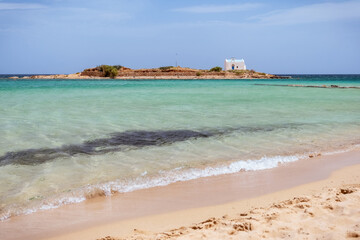 Hypnotic seascape from Malia beach in Crete, Greece. Afentis Christos is a small sea islet with a...