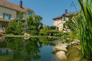 garden pond with stone shores, pond in the garden