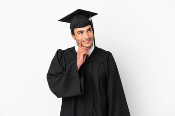 Young university graduate over isolated white background thinking an idea while looking up