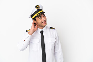 Airplane pilot over isolated white background thinking an idea