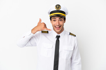 Airplane pilot over isolated white background making phone gesture. Call me back sign