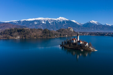 Bled Lake, Marijinega Vnebovzetja Church and Blejski Grad on Sunny Day. Julian Alps and Reflection...