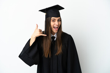 Young university graduate isolated on white background making phone gesture. Call me back sign