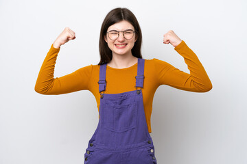 Young Russian woman isolated on blue background doing strong gesture