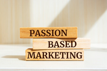 Wooden blocks with words 'PASSION BASED MARKETING'.