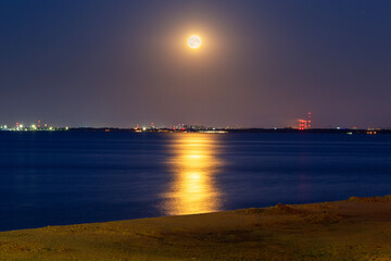 Fototapeta na wymiar Full moon in July at Baltic Sea in Gdynia Orlowo. Poland