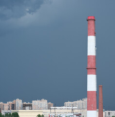 pipes of thermal power plant, industrial plant in a city. ecology and environmental pollution