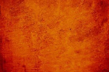 Dark red orange texture.Toned rough concrete wall surface. Close-up. Bright colorful background...